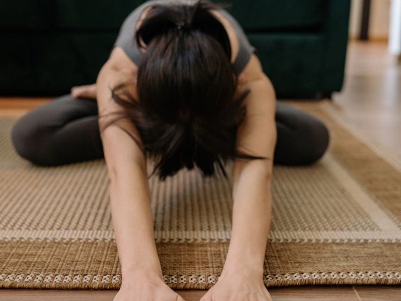 Person practicing yoga in a calm, focused environment.